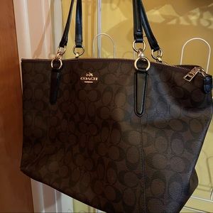 Chocolate brown coach purse and watching wallet